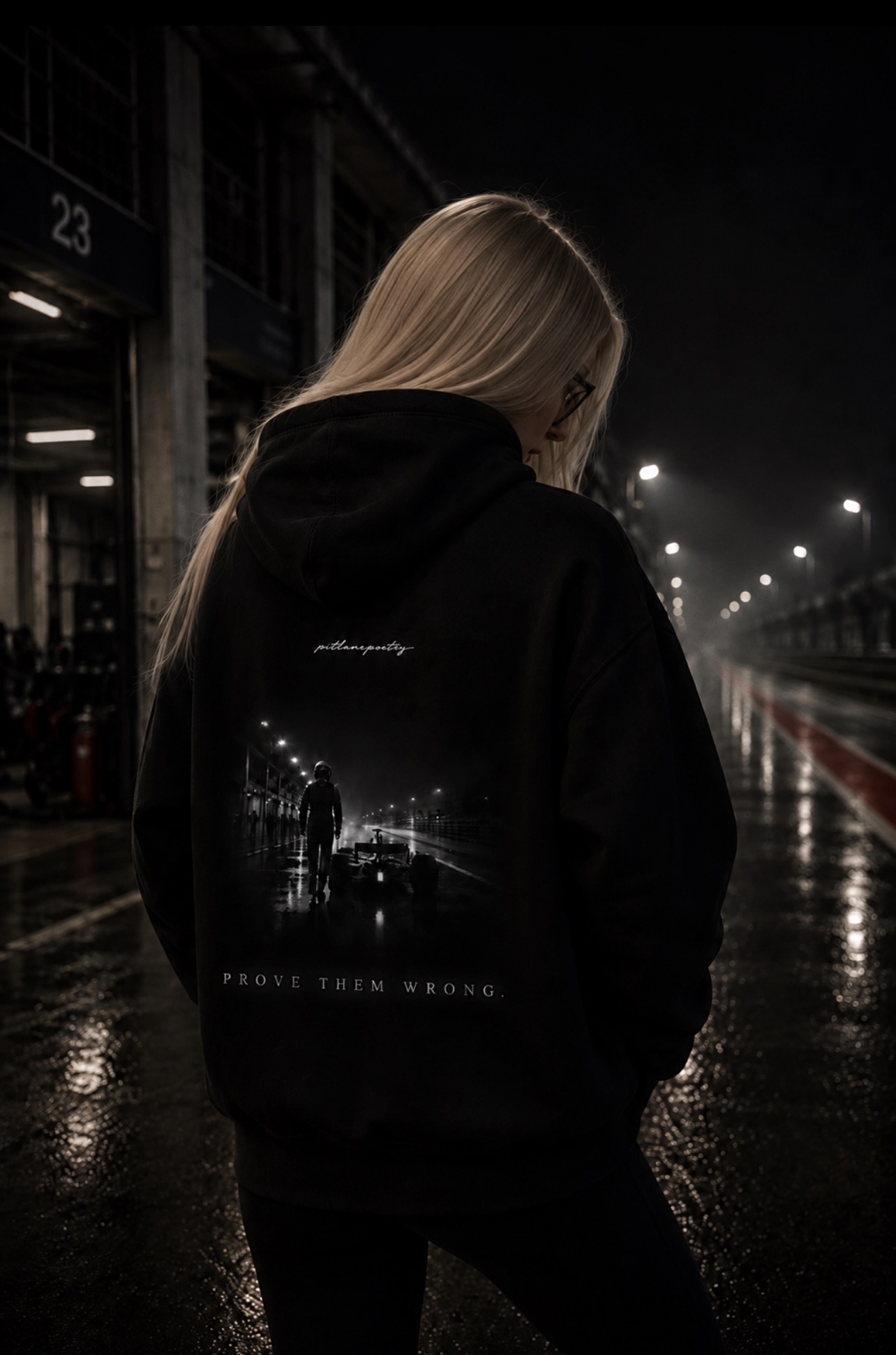 PITLANEPOETRY hoodie worn at night in the pit lane